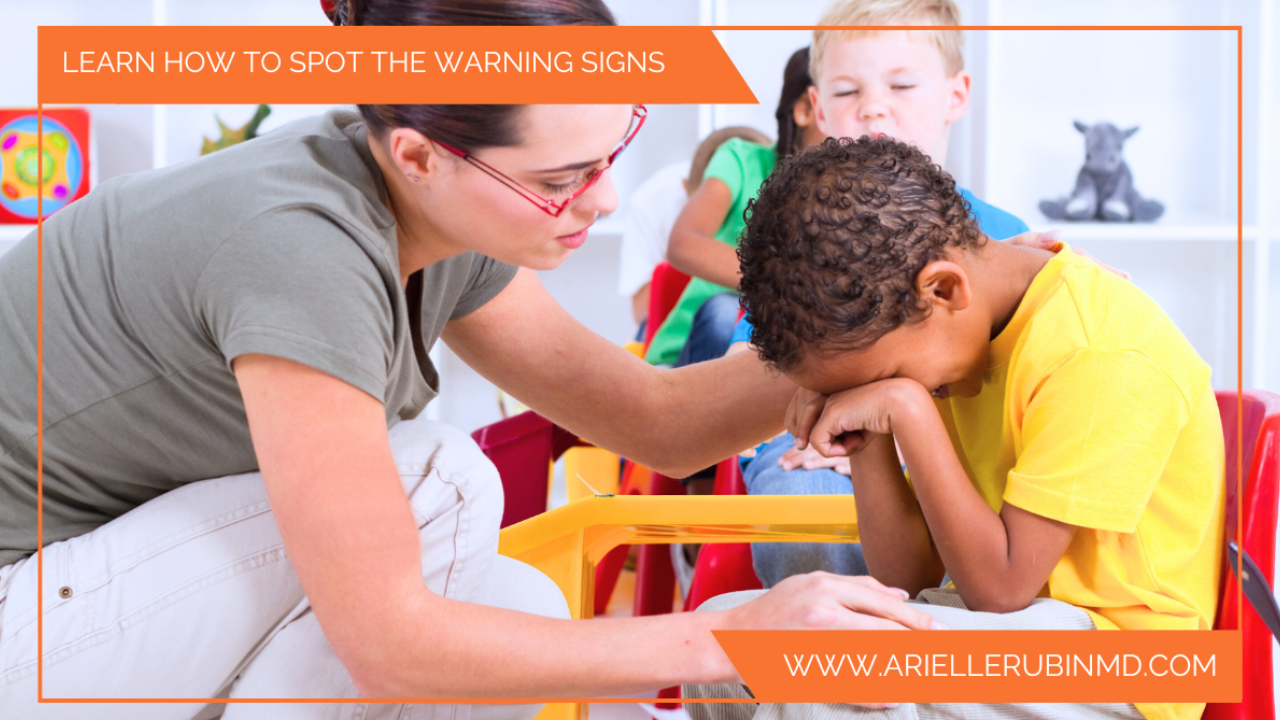 Teacher comforting crying upset child student